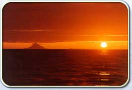 Sunset beside Mt. Augustine, an active volcano